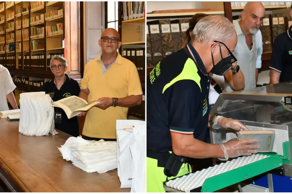 A ‘special team’ while recovering books damaged by bad weather at Panizzi
