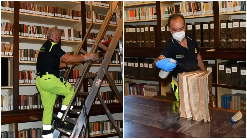 A ‘special team’ while recovering books damaged by bad weather at Panizzi