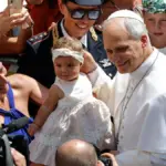 Crowd surge for Leone. The emotion of mothers and children seeking a caress