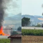 Warehouse in smoke, possibly flames sparked by lightning during the storm
