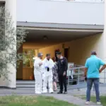 Wait for the caregiver to leave, then kills her husband with a knife